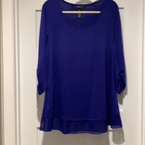 Round neck top with chiffon hemline.